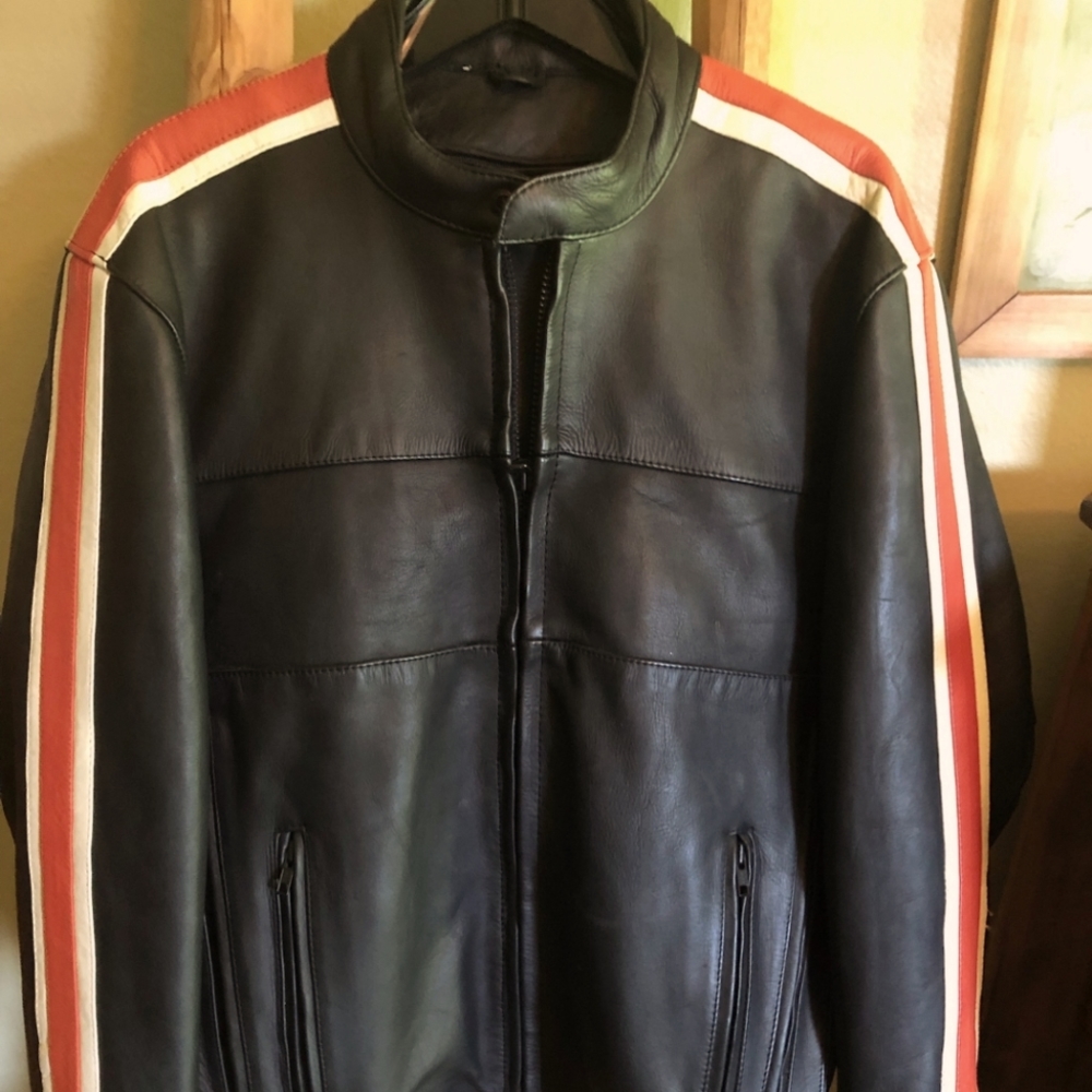 Motorcycle jacket.  Medium. Leather. Lined. Gussets. Zippers.